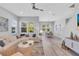 Bright living room featuring a cozy sectional sofa, stylish decor, and dining area with ample natural light at 2283 Arlington St, Sarasota, FL 34239