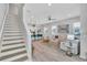 Open-concept living area showcasing kitchen island seating and stylish, comfortable furniture at 2283 Arlington St, Sarasota, FL 34239