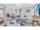 Spacious open concept living room with neutral furniture and beach themed artwork at 2283 Arlington St, Sarasota, FL 34239