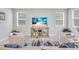 Cozy living room with beach themed decor, lots of natural light and neutral furniture at 2283 Arlington St, Sarasota, FL 34239