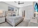 Comfortable bedroom boasts a ceiling fan, stylish decor, and a serene ambiance at 2283 Arlington St, Sarasota, FL 34239