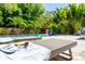 Inviting outdoor space with a pool, lounge chairs, and tropical landscaping at 2283 Arlington St, Sarasota, FL 34239