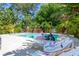 Relaxing pool and lounge area surrounded by lush tropical landscaping for privacy at 2283 Arlington St, Sarasota, FL 34239