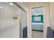 Bathroom featuring a glass-enclosed shower and open view to the teal-blue Primary bedroom at 2434 Carlisle Pl, Sarasota, FL 34231