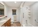 Bright bathroom showcasing a shower-tub combo and granite vanity with tile flooring at 2434 Carlisle Pl, Sarasota, FL 34231