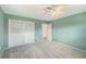 Spacious bedroom featuring neutral carpet and ample natural light with a ceiling fan at 2434 Carlisle Pl, Sarasota, FL 34231