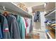 Organized walk-in closet with shelving and hanging rods for efficient storage at 2434 Carlisle Pl, Sarasota, FL 34231