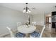 This dining room features a table with seating, chandelier and kitchen access at 2434 Carlisle Pl, Sarasota, FL 34231