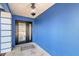 Inviting front entry features a decorative glass door and a classic overhead light fixture at 2434 Carlisle Pl, Sarasota, FL 34231