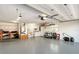 Spacious garage with painted floor and plenty of open room for vehicle parking and storage at 2434 Carlisle Pl, Sarasota, FL 34231