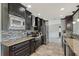 Sleek kitchen with stainless steel appliances, granite countertops, and decorative backsplash at 2434 Carlisle Pl, Sarasota, FL 34231