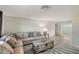 Bright living room featuring a comfortable sectional sofa and stylish wooden coffee table at 2434 Carlisle Pl, Sarasota, FL 34231