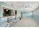 Bright sunroom with bar seating overlooking the kitchen at 2434 Carlisle Pl, Sarasota, FL 34231