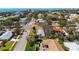Beautiful aerial view of a residential area with mature trees, manicured lawns, and tile roofs, near the ocean at 317 Harbor S Dr, Venice, FL 34285