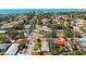 Nice aerial view of a residential neighborhood with a mix of home styles, mature trees, and well-maintained lawns at 317 Harbor S Dr, Venice, FL 34285