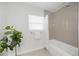 Bathroom with a tiled shower and tub with white shower curtain at 317 Harbor S Dr, Venice, FL 34285