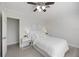 Second bedroom featuring crisp white walls, a ceiling fan and tiled floors at 317 Harbor S Dr, Venice, FL 34285
