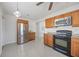 Bright kitchen featuring stainless steel appliances and wood cabinetry at 317 Harbor S Dr, Venice, FL 34285