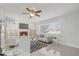 Bright living room featuring a fireplace, modern decor, and sleek tile flooring, a great space to relax at 317 Harbor S Dr, Venice, FL 34285