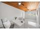 Stylish room with tile flooring, wood ceiling and white walls creating a cozy atmosphere at 317 Harbor S Dr, Venice, FL 34285