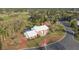 Stunning aerial perspective of the property showing the landscaping, and proximity to the golf course at 3215 Pine Valley Dr, Sarasota, FL 34239