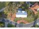 Aerial view of home featuring a pool, beautiful landscaping, and circular driveway at 3215 Pine Valley Dr, Sarasota, FL 34239