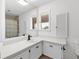 Bathroom featuring a large vanity, mirror, and a shower and tub combo at 3215 Pine Valley Dr, Sarasota, FL 34239