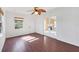 Bedroom with hardwood floors, ceiling fan, and natural light at 3215 Pine Valley Dr, Sarasota, FL 34239