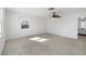 Spacious bedroom features a ceiling fan and a large window for ample natural light at 3215 Pine Valley Dr, Sarasota, FL 34239