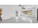 Bonus room with tile flooring, ceiling fan, and views of the pool at 3215 Pine Valley Dr, Sarasota, FL 34239