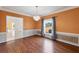 Elegant dining room with warm wall color, chandelier, and trim details, creating a welcoming space at 3215 Pine Valley Dr, Sarasota, FL 34239