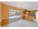Dining room with a view of the pool, stylish lighting, and tile flooring at 3215 Pine Valley Dr, Sarasota, FL 34239