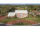 Well-maintained brick home with a blue front door, mature landscaping, and a circular driveway at 3215 Pine Valley Dr, Sarasota, FL 34239