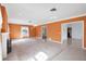 Cozy living room featuring tile floors, a decorative fireplace, and plenty of natural light at 3215 Pine Valley Dr, Sarasota, FL 34239