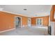 Inviting living room with tile flooring, staircase, and ample natural light at 3215 Pine Valley Dr, Sarasota, FL 34239