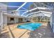 Enjoy the screened-in pool with its outdoor living and entertaining area at 3215 Pine Valley Dr, Sarasota, FL 34239