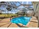 Sparkling pool enclosed in a screened lanai, providing a perfect spot for outdoor enjoyment at 3215 Pine Valley Dr, Sarasota, FL 34239