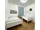 Bright bedroom featuring two twin beds and decorative wall art at 3650 S Sumter Blvd, North Port, FL 34287