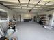 Spacious garage with ample storage space, epoxy flooring, and a utility sink at 3650 S Sumter Blvd, North Port, FL 34287