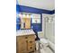 Bright, blue bathroom featuring a single sink vanity and tub with shower at 3721 Delta St # 93, Sarasota, FL 34232