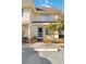 Well-maintained two-story condo with manicured landscaping near the main entrance at 3721 Delta St # 93, Sarasota, FL 34232
