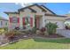 Beautiful home featuring colorful shutters, stone accents, manicured lawn, and brick paved driveway at 3815 75Th E Ln, Palmetto, FL 34221