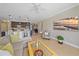 Spacious living room shows a view of the open kitchen with barstool seating at 3815 75Th E Ln, Palmetto, FL 34221