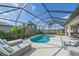 Beautiful screened-in pool with comfortable lounge chairs and a scenic view, perfect for relaxation at 3815 75Th E Ln, Palmetto, FL 34221