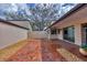 Private backyard featuring brick patio, rock garden, and peaceful setting at 3933 Glen Oaks Manor Dr, Sarasota, FL 34232