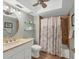 Bathroom featuring a vanity, sink, toilet, shower-tub combination, and modern fixtures at 3933 Glen Oaks Manor Dr, Sarasota, FL 34232