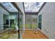 Intimate courtyard featuring gravel landscaping, statues, and expansive windows offering natural light and views at 3933 Glen Oaks Manor Dr, Sarasota, FL 34232