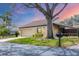 Charming single-story home with a well-maintained lawn, mature shade tree, and inviting curb appeal at 3933 Glen Oaks Manor Dr, Sarasota, FL 34232