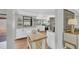 Bright kitchen with white cabinets, an island, stainless steel appliances, and lots of natural light at 3933 Glen Oaks Manor Dr, Sarasota, FL 34232