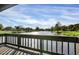 Relaxing view of the pond from the deck, surrounded by trees and landscaping at 3933 Glen Oaks Manor Dr, Sarasota, FL 34232